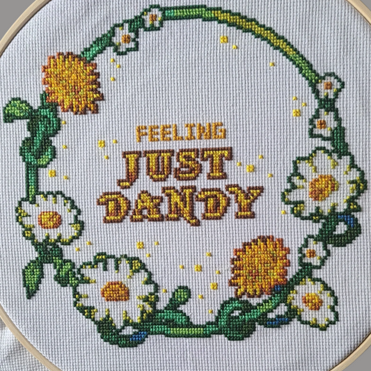 Zoomed in picture showing the circle version of the Feeling Dandy Cross-stitch pattern by Rolitae.